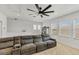 Comfortable living room area featuring a sectional sofa and plenty of natural light at 11037 77Th E St, Parrish, FL 34219
