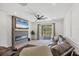 Bright living room with a modern electric fireplace, large TV, and a comfortable leather sectional sofa at 11037 77Th E St, Parrish, FL 34219