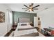 Beautiful primary bedroom features hardwood floors, natural light, and sophisticated wall paneling at 11037 77Th E St, Parrish, FL 34219