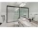 Bright bathroom showcasing granite countertop, single sink vanity and shower over tub at 1110 93Rd Nw St, Bradenton, FL 34209