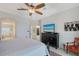 Comfortable bedroom featuring a four-poster bed, TV, ensuite bath and neutral decor for a cozy atmosphere at 1110 93Rd Nw St, Bradenton, FL 34209