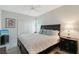 Comfortable bedroom with a queen-size bed, dark wood furniture, and a ceiling fan at 1110 93Rd Nw St, Bradenton, FL 34209
