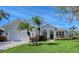 Charming home with lush landscaping, a two-car garage, and an inviting front entrance at 1110 93Rd Nw St, Bradenton, FL 34209