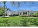 Beautiful single-Gathering home with manicured front yard, garden, and attached two-car garage at 1110 93Rd Nw St, Bradenton, FL 34209