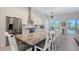 Spacious kitchen featuring modern appliances, a granite island with seating, and a bright breakfast nook at 1110 93Rd Nw St, Bradenton, FL 34209