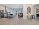 Bright open-concept living and dining area with hardwood flooring and an abundance of natural light at 1110 93Rd Nw St, Bradenton, FL 34209
