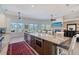 Gourmet kitchen with granite island is open to the spacious living room at 1110 93Rd Nw St, Bradenton, FL 34209