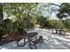 A shady picnic area features multiple tables under trees, providing an inviting spot for outdoor gatherings at 1110 93Rd Nw St, Bradenton, FL 34209