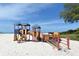 Beachside playground with climbing structures and slides on white sand at 1110 93Rd Nw St, Bradenton, FL 34209