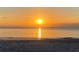 Brilliant golden sunrise over the ocean's tranquil horizon at 1110 93Rd Nw St, Bradenton, FL 34209