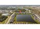Stunning aerial view of lakeside homes; serene community living with picturesque water views at 11221 Gallatin Trl, Parrish, FL 34219
