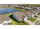 Aerial view showing a house with a well manicured lawn in a well-planned community with water views at 11221 Gallatin Trl, Parrish, FL 34219