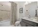 Inviting bathroom featuring a shower-tub, vanity with a sleek countertop at 11221 Gallatin Trl, Parrish, FL 34219