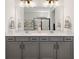 Bathroom boasts double sinks, ample cabinet space, and modern fixtures at 11221 Gallatin Trl, Parrish, FL 34219