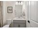 Stylish bathroom with a sleek vanity, modern fixtures, and decorative art at 11221 Gallatin Trl, Parrish, FL 34219