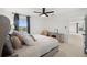 A well-lit bedroom featuring a serene view from the window and a cozy chair and dresser at 11221 Gallatin Trl, Parrish, FL 34219