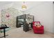 Playful ' bedroom featuring a loft bed, colorful wallpaper, and cozy reading nook at 11221 Gallatin Trl, Parrish, FL 34219
