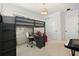 Cozy bedroom with unique bunk bed, desk, and ample storage space at 11221 Gallatin Trl, Parrish, FL 34219