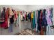Organized walk-in closet with ample storage space and a patterned rug at 11221 Gallatin Trl, Parrish, FL 34219