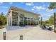 Community center featuring spacious outdoor seating areas and views of the surrounding landscaping at 11221 Gallatin Trl, Parrish, FL 34219