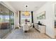 Bright dining area with a water view and sliding glass doors for seamless outdoor access at 11221 Gallatin Trl, Parrish, FL 34219