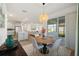 Open-concept floor plan with dining area, living room, and kitchen perfect for entertaining at 11221 Gallatin Trl, Parrish, FL 34219