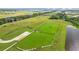 Aerial view of a large community dog park surrounded by green space and walking trails at 11221 Gallatin Trl, Parrish, FL 34219