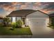 Charming single-story home with manicured lawn, two-car garage, and beautiful landscaping at 11221 Gallatin Trl, Parrish, FL 34219