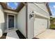 Close-up of the front door and two car garage of the home, showcasing the facade at 11221 Gallatin Trl, Parrish, FL 34219