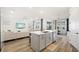 Bright, open-concept space has a seamless flow between living room, island, and dining area at 11221 Gallatin Trl, Parrish, FL 34219