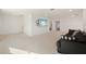 Bright and spacious loft features a cozy sofa and media entertainment center at 11221 Gallatin Trl, Parrish, FL 34219