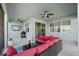 Relaxing covered patio with comfortable seating, ceiling fans, and a built-in grill at 11221 Gallatin Trl, Parrish, FL 34219