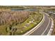 Aerial view of community recreational area with pond, trails and pump track at 11221 Gallatin Trl, Parrish, FL 34219