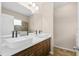 Bathroom featuring dual sinks and modern vanity at 11790 Fennemore Way, Parrish, FL 34219