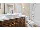 Bathroom featuring a modern vanity with dark wood cabinets and square sink at 11790 Fennemore Way, Parrish, FL 34219