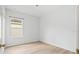 Cozy, bright bedroom featuring wood floors and a view of the neighborhood at 11790 Fennemore Way, Parrish, FL 34219
