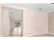 Bright entryway featuring wood flooring with an open view of the dining and living area at 11790 Fennemore Way, Parrish, FL 34219