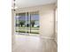 Bright living room featuring sliding glass doors to bring the outside in, coupled with neutral tones at 11790 Fennemore Way, Parrish, FL 34219