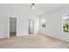 Bright main bedroom with wood flooring and a view of the backyard at 11790 Fennemore Way, Parrish, FL 34219