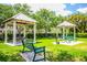 Outdoor picnic area with covered gazebos and lush green lawns at 11790 Fennemore Way, Parrish, FL 34219