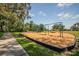 Playground with mulch base and a swing set for entertainment at 11790 Fennemore Way, Parrish, FL 34219