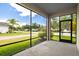 Relaxing screened porch with views of the landscaped yard and neighborhood, ideal for outdoor living at 11790 Fennemore Way, Parrish, FL 34219