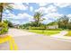 Welcoming entrance to the Forest Creek community, featuring manicured landscaping and a clear street view at 11790 Fennemore Way, Parrish, FL 34219