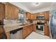 Well-lit kitchen featuring stainless steel appliances, granite countertops, and ample cabinet space at 1248 Jefferson Dr, Englewood, FL 34224