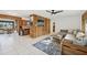 Open-concept living room with stylish décor and wood accents, seamlessly flowing into the kitchen at 1248 Jefferson Dr, Englewood, FL 34224