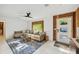 Cozy living room features a comfortable sofa, accent rug, and ample natural light at 1248 Jefferson Dr, Englewood, FL 34224