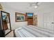 Comfortable main bedroom with built-in TV and ensuite bathroom at 1248 Jefferson Dr, Englewood, FL 34224
