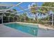 Beautiful in-ground pool within a screened enclosure, offering a private and relaxing outdoor space at 1248 Jefferson Dr, Englewood, FL 34224