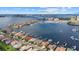 Expansive aerial view showcases waterfront homes, marina with boats, and the cityscape in the distance at 125 12Th E Ave, Palmetto, FL 34221