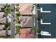 Aerial view of upscale waterfront homes with private docks, pools, and well-manicured landscaping, offering luxurious coastal living at 125 12Th E Ave, Palmetto, FL 34221